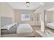 Bedroom with neutral tones, window with blinds and mirrored closets at 904 Rhyolite Ter, Henderson, NV 89011