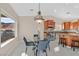 Cozy dining area next to the kitchen with large windows providing plenty of natural light at 904 Rhyolite Ter, Henderson, NV 89011