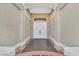 Inviting entryway featuring double doors, columns, and textured walls for a grand entrance at 904 Rhyolite Ter, Henderson, NV 89011