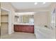 Bright main bathroom features a double vanity, jetted tub, and separate shower at 904 Rhyolite Ter, Henderson, NV 89011