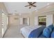 Well-lit main bedroom with carpet and access to the main bathroom at 904 Rhyolite Ter, Henderson, NV 89011
