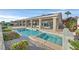 Beautiful backyard pool with a spa, covered patio, and lush landscaping, perfect for outdoor living at 904 Rhyolite Ter, Henderson, NV 89011