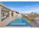 A pristine pool and spa offer a relaxing backyard oasis with city views from the elevated lot at 904 Rhyolite Ter, Henderson, NV 89011