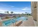 Inviting pool with sunning deck and palm tree views at 904 Rhyolite Ter, Henderson, NV 89011