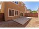 Backyard featuring sliding glass door and concrete patio at 9773 Bedstraw St, Las Vegas, NV 89178