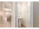 Cozy powder room with white pedestal sink and modern lighting at 9773 Bedstraw St, Las Vegas, NV 89178