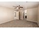 Bedroom boasts neutral paint, carpeting, ceiling fan and attached bathroom at 9773 Bedstraw St, Las Vegas, NV 89178