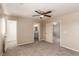 Carpeted bedroom has a ceiling fan and two doorways leading to other rooms at 9773 Bedstraw St, Las Vegas, NV 89178