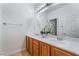 Bathroom features double sinks, vanity with modern lighting, creating an inviting atmosphere at 9812 Turtle Walk Ave, Las Vegas, NV 89149