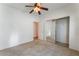 Bedroom features carpeted flooring, ceiling fan, and a closet, designed for comfort and practical living at 9812 Turtle Walk Ave, Las Vegas, NV 89149