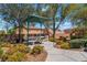 Inviting community park featuring a shaded picnic area with a table and lush landscaping at 9812 Turtle Walk Ave, Las Vegas, NV 89149