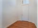 Minimalist entryway with wood floors and a white front door at 9812 Turtle Walk Ave, Las Vegas, NV 89149