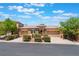 Inviting single-story home with a three-car garage and well-manicured landscaping on a sunny day at 9812 Turtle Walk Ave, Las Vegas, NV 89149