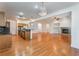 Large living area with view to the kitchen featuring a chandelier and fireplace at 9812 Turtle Walk Ave, Las Vegas, NV 89149
