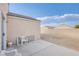 View of empty backyard space with concrete patio, block wall, and low-maintenance gravel landscaping at , Las Vegas, NV 89130