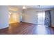 Spacious living room featuring wood floors, ceiling fan, and sliding glass doors to the backyard at , Las Vegas, NV 89130