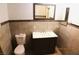 Bathroom featuring tile flooring, tile walls, dark vanity and toilet at 10 E Bonanza Rd, Las Vegas, NV 89101