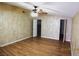 Spacious bedroom with hardwood flooring, a ceiling fan, and white doors at 10 E Bonanza Rd, Las Vegas, NV 89101