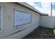 A side view of a charming, single-story home featuring gated windows and xeriscaping at 10 E Bonanza Rd, Las Vegas, NV 89101