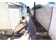 Exterior side yard with a concrete walkway and block wall at 10 E Bonanza Rd, Las Vegas, NV 89101