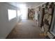 Living room featuring stone accent wall and neutral carpeting at 10 E Bonanza Rd, Las Vegas, NV 89101