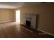 Living room boasts new hardwood flooring and a cozy painted brick fireplace, perfect for gatherings at 10 E Bonanza Rd, Las Vegas, NV 89101