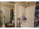 Bathroom with a shower and a floral shower curtain at 10049 Fragile Fields St, Las Vegas, NV 89183