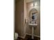 Bathroom with a pedestal sink and a mirror at 10049 Fragile Fields St, Las Vegas, NV 89183
