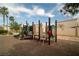 Community playground with a slide and climbing structures, providing a safe and fun environment for children at 10049 Fragile Fields St, Las Vegas, NV 89183