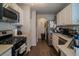 Functional kitchen with white cabinets, modern appliances, and a streamlined design at 10049 Fragile Fields St, Las Vegas, NV 89183