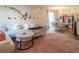 Open concept living and dining area featuring modern decor, plush seating, and stylish accents at 10049 Fragile Fields St, Las Vegas, NV 89183