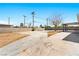 Expansive backyard featuring a concrete patio area and block wall fencing for added privacy at 1020 Baker Ave, Las Vegas, NV 89108
