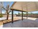 Large backyard featuring covered patio and mature shade tree at 1020 Baker Ave, Las Vegas, NV 89108