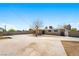 Spacious backyard featuring a concrete area and mature trees at 1020 Baker Ave, Las Vegas, NV 89108