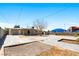 Spacious backyard with a covered patio, concrete area and block wall at 1020 Baker Ave, Las Vegas, NV 89108