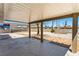 Covered patio area with a view of a large backyard and block wall at 1020 Baker Ave, Las Vegas, NV 89108