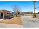 Large backyard with shade trees, covered patio and block wall at 1020 Baker Ave, Las Vegas, NV 89108