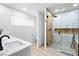 Elegant bathroom with a glass-enclosed shower, modern fixtures, and bright lighting at 1020 Baker Ave, Las Vegas, NV 89108