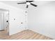 Bedroom featuring light wood-look floors, modern ceiling fan and neutral paint at 1020 Baker Ave, Las Vegas, NV 89108