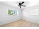 Bedroom with ceiling fan, natural light, and wood-look flooring at 1020 Baker Ave, Las Vegas, NV 89108