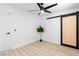 Light bedroom includes barn-style sliding door and new wood-style flooring at 1020 Baker Ave, Las Vegas, NV 89108