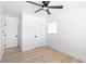 Neutral bedroom featuring ceiling fan, wood floors, and crisp white walls at 1020 Baker Ave, Las Vegas, NV 89108