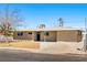 Charming exterior view of the house with freshly painted walls and manicured landscaping at 1020 Baker Ave, Las Vegas, NV 89108