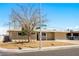 View of single-story home showcasing desert landscaping and street view at 1020 Baker Ave, Las Vegas, NV 89108