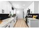 Modern kitchen featuring white cabinets, sleek black hardware, and stunning countertops at 1020 Baker Ave, Las Vegas, NV 89108