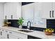 Beautifully renovated kitchen featuring quartz countertops, black hardware, and modern sink at 1020 Baker Ave, Las Vegas, NV 89108