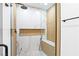 Modern shower with glass door, rainfall showerhead, built-in niche, and decorative tile at 1020 Baker Ave, Las Vegas, NV 89108