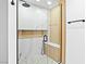 Beautifully tiled shower with glass door, rainfall showerhead, built-in niche, and mosaic tile flooring at 1020 Baker Ave, Las Vegas, NV 89108