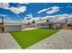 Spacious backyard featuring a grassy area, gravel landscaping, and a storage shed at 108 Prince Ln, Las Vegas, NV 89110