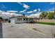 This backyard features a spacious patio and a strip of artificial turf at 108 Prince Ln, Las Vegas, NV 89110